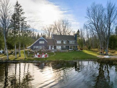 Discover the epitome of lakeside living at 6746 Driftwood Drive in Petoskey, MI. Nestled close to town, this exquisite home boasts 230 feet of frontage on Crooked Lake, offering stunning waterfront views that promise serene mornings and peaceful even...