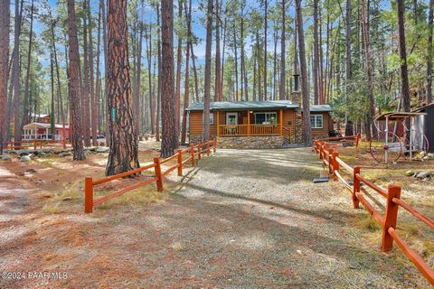 Welcome to your serene retreat at 1113 East Stagecoach Road in Groom Creek! Nestled amidst the tranquil beauty of the Ponderosa Pines, yet astonishingly close to the vibrant heart of downtown Prescott, this adorable log sided cabin offers a perfect b...