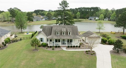 Introducing a stunning lowcountry designed lakefront home, perfect for those who appreciate timeless elegance and modern convenience. This spacious 4 bedroom, 2.5 bathroom home boasts an open floor plan, creating a welcoming atmosphere for relaxation...