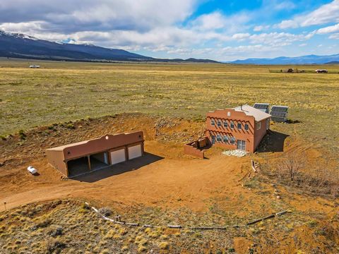 ~MOTIVATED SELLER - BRING OFFERS~ 40-acre ranch at the base of Sangre De Cristo mountains, 1570 sqft southwest-style home with passive solar design, solar-powered, 4-bay barn/garage, private and defensible space. An additional 40+ acre property is av...