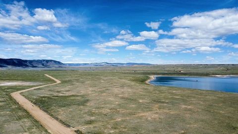 A rare opportunity to own lakefront property in Wild Horse Ranch, a wild horse sanctuary in southern Wyoming. Located 20 minutes from Laramie on the southwest bank of Twin Buttes Lake, this parcel offers spectacular views of the lake and Sheep Mounta...