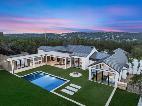 Immerse yourself in the lifestyle of luxurious living in this newly constructed home, situated in the elite gated community of Paleface Ranch in Spicewood, Texas. This modern ranch style house, a masterpiece crafted by the renowned Kelley Design Grou...