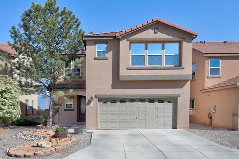 **OWNED SOLAR for super low electric bills!!**Live passionately in this exciting residence with the BEST possible panoramic views of the Albuquerque valley and majestic Sandia Mountain range! No more compromising with this exceptional residence. Spec...