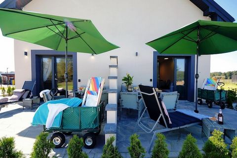On the edge of a charming seaside settlement, there is a family holiday resort, which offers accommodation in two-story terraced houses and plenty of green space for children to play various games and have fun. Two-story holiday homes with terraces a...