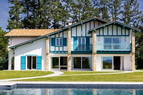 Exclusive. Arcangues - Popular neighborhood. In the heart of a wooded park of approx. 6,700m2 facing south, traditional Basque and Arcangues blue architecture 428m2 villa with swimming pool and view of the Pyrenees. First floor: entrance, 2 living ro...