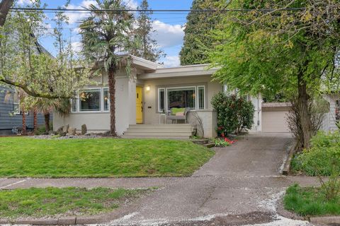 A Mediterranean Oasis in Desirable Laurelhurst. One block from Laurelhurst Elementary School, close to Providence. Spacious living room with beautiful hardwoods, fireplace, coved ceiling, and arched entries. Light and bright dining room with open she...
