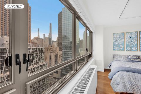 Welcome to your high-floor, spacious classic Alcove Studio/Jr 1 Bedroom! This home is bathed in natural light throughout the day through expansive floor-to-ceiling windows that capture stunning views of surrounding cityscape. This city 