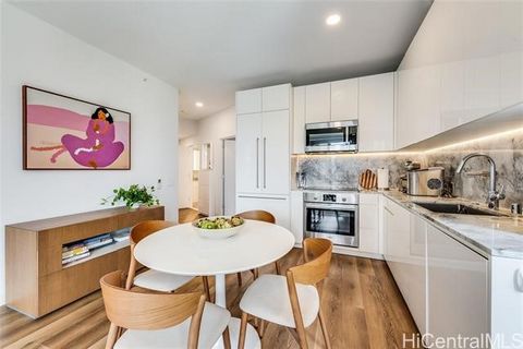 Experience luxury living at 'A'ali'i in the heart of Ward Village in Kaka'ako! This stunning front-corner 2-bedroom, 2-bath condo, designed by renowned Solomon Cordwell Buenz and Rottet Studio, offers a modern, sophisticated lifestyle in one of Honol...