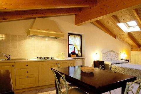 On a high plateau at 600 m altitude with an unforgettable view of Lake Garda. The rustico from the 17th century is quietly located in the middle of the Parco Alto Garda Bresciano nature reserve. The old stone house has been completely rebuilt respect...