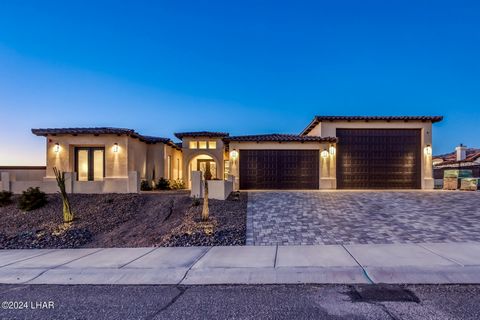 Welcome to this beautiful home at 1001 Avenida Del Sol, set in the peaceful Havasu Foothill Estates. Built in 2022, this property offers a blend of modern living and comfort across 2,850 sq/ft. It features four bedrooms, five baths, and includes a se...