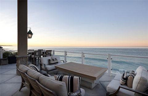 Immerse yourself in luxury at this exquisite oceanfront home, a true jewel in Orange County's most coveted coastal neighborhood. Commanding a prestigious position on Beach Road, this home stretches across a 1.7-mile sandy expanse, nestled between the...
