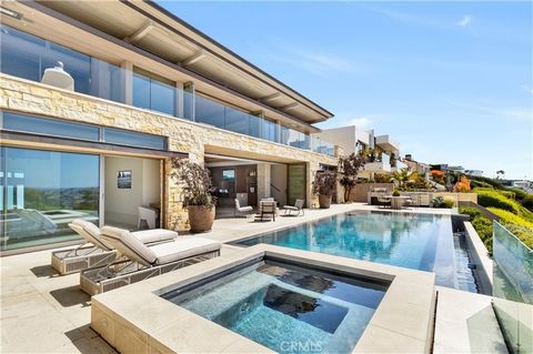 This unparalleled custom residence in the sought-after Newport Beach enclave of Irvine Terrace delivers the ultimate in contemporary luxury, offering front-row vistas of Newport Harbor, Balboa Island, the Pacific Ocean, and Catalina Island. The inspi...