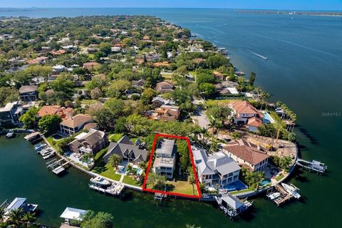 RARELY AVAILABLE waterfront property on Davis Islands, one of South Tampa's most desired neighborhoods. Build your dream home on approximately .26 Acres and 90 feet of seawall just one home to the open bay with direct water access. The canal location...