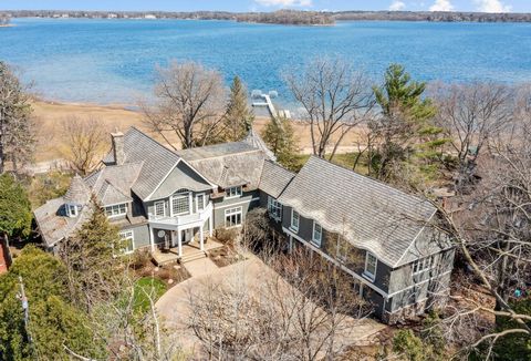 Custom built estate situated on 1.16 acres w/129' of sandy shoreline on White Bear Lake. Impressive from the moment you step inside, this exquisite home is filled w/rich architectural detailing, designer styling & high-end finishes. Each floor is des...