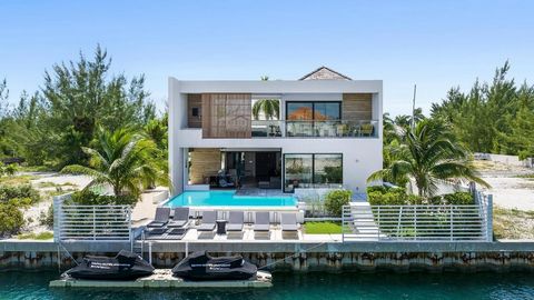 A luxury, canal-front villa featuring a modern, two-story, open-concept design with 2,043 -sf of spacious and fluid living giving it a contemporary and stylish appearance. Located in the secure community of Leeward, this adds to the exclusivity and p...