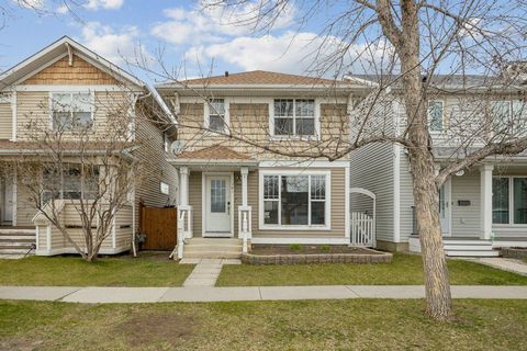 Welcome to this 3-bedroom, 2.5-bathroom home resides on a peaceful street within the family friendly community of McKenzie Towne. The main level showcases an inviting open-concept layout, enhanced by charming rustic laminate flooring and expansive wi...