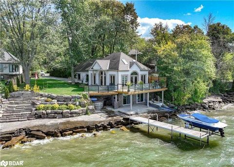 Welcome to your year-round oasis with approximately 82 ft of direct waterfront on Lake Simcoe. This stunning home or 4 season cottage offers the perfect blend of modern luxury and natural beauty, ensuring a tranquil escape from the bustling city life...