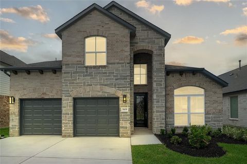 LONG LAKE NEW CONSTRUCTION - Welcome home to 18439 Windy Knoll Way located in the community of Grand Oaks and zoned to Cypress-Fairbanks ISD. This floor plan features 4 bedrooms, 3 full baths, 1 half bath, and an attached 3-car garage with NO BACK NE...