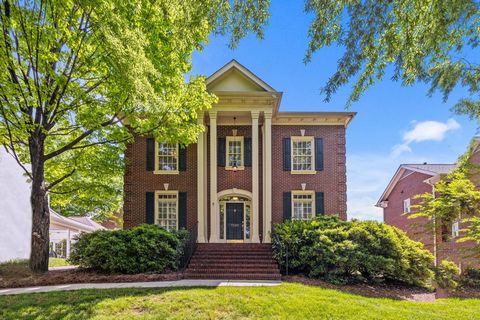 Stately and beautiful brick home in Prescott Place at Beverly Crest, where elegance and comfort harmonize seamlessly. Warmth and sophistication permeates home. Crown molding adds a touch of refinement. Plantation shutters on main level provide privac...