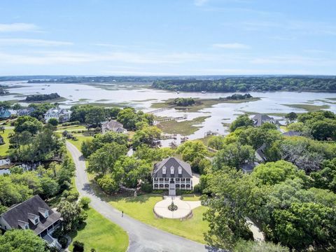 Southern elegance and waterfront beauty combine to make this dream home everything you have imagined about living your best life in the Lowcountry. This stately elevated brick home is a high quality custom residence with tasteful finishes throughout....