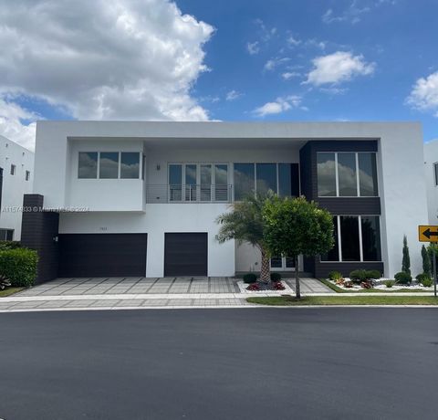 Modern 75 at Doral, exclusive community with 5 beds and 6 baths, pool, Ready to move, Turnkey, Custom lighting throughout the property, premium six-zone wireless audio system. Double-height wall finished in top-quality carpentry with an integrated TV...