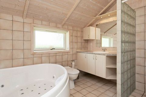 Holiday cottage for the family appreciating comfort and interesting details. Bathroom with whirlpool and sauna for relaxation after a long day exploring the area.