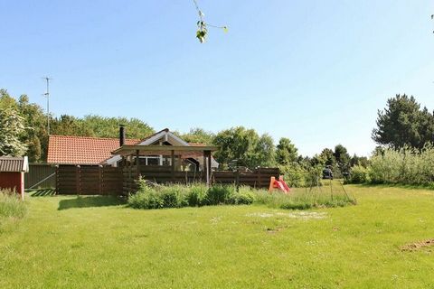 Holiday home located on a large plot with a partially covered terrace with fences around, so you are undisturbed when you sunbathe and grill etc. There are football goals and swing. There is walking distance to the beach. Restaurant and mini golf are...