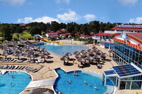 A modern, family holiday resort is located in the vicinity of a forest, in a peaceful and quiet area. In the immediate vicinity there is one of the biggest attractions of the resort - a large and attractive swimming pool complex, the Tropicana aquapa...
