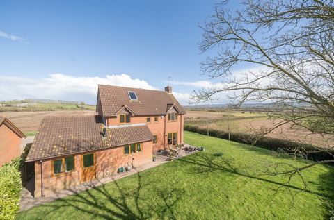 Tucked away beside open farmland, 2 Monument View offers a charming lifestyle retreat with breathtaking panoramic views of the surrounding countryside, stretching all the way to the iconic Wellington Monument on the Blackdown Hills. This detached 4-b...