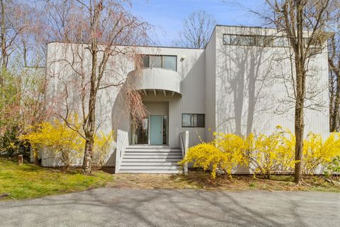 Enjoy sunrise and sunset views from this contemporary four bedroom house located on a quiet country road just minutes from both Mt. Kisco and Armonk. Designed by prominent architect Edward Ozols, 71 Tripp Street is a special home, offering complete p...