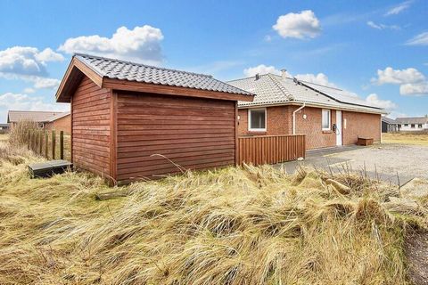 Tasteful and bright cottage with whirlpool, sauna and activities suitable for several families located approx. 200 meters from the roaring North Sea. The house is handicap friendly both outdoors and indoors with i.a. paving stones with easy access to...