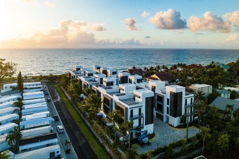 Sensational and contemporary describes the unique architecture of this recently constructed corner townhouse located at 11497 Old Ocean Blvd. in the gated enclave of Gulf Stream Views along the sought-after Old Ocean corridor of Ocean Ridge. Designer...