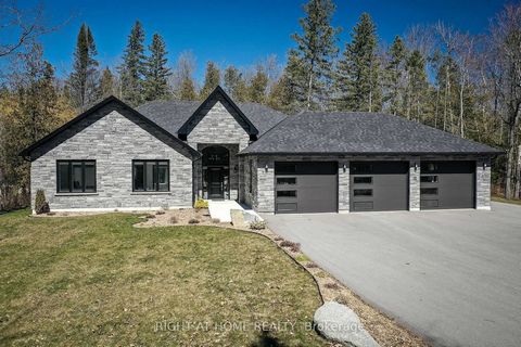 Two years new built home (2022). It features 3 bedrooms, 3 bathrooms, very open spacious kitchen and living room with wood burning fireplace. Very private landscape. This bungalow features NO steps anywhere...a nice want for many. There is in floor h...