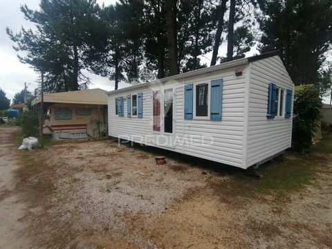 Mobile Home located in Camping Vasco da Gama in Pinhal Novo, Equipped with hob, oven, extractor fan, cylinder, TV and fridge, 2 bedrooms equipped with beds, Living room with open space sofas and TV included, 2 Bathrooms, Some surrounding terrain, Par...