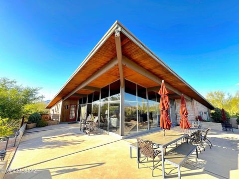 Discover timeless elegance in this meticulously restored mid-century modern masterpiece by Tucson architect Arthur Brown, crafted in 1966. Soaring beams and windows in the great room flood the interior with natural light, embracing passive solar desi...