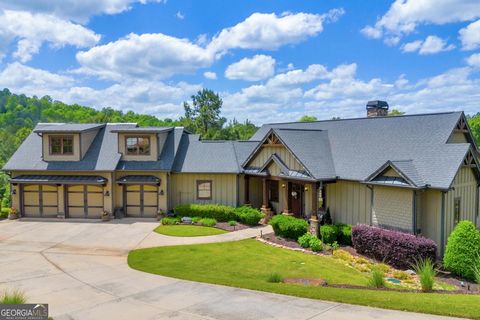 Welcome to 1644 Currahee Club Drive, Toccoa, GA 30577 - where luxury living meets unparalleled elegance. As you step into this exquisite residence, you'll be greeted by a breathtaking view of Green #16, setting the stage for the remarkable features t...