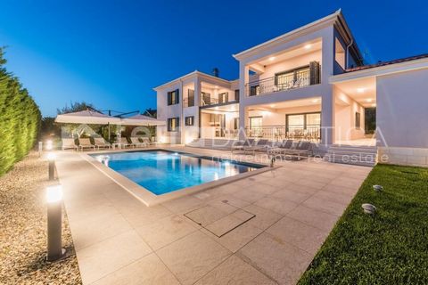 A spectacular villa with a large pool is for sale, located in the heart of the Adriatic, not far from Zadar, in the municipality of Sukosan. The villa built in 2018 offers a perfect combination of beauty and practicality, and the combination of moder...