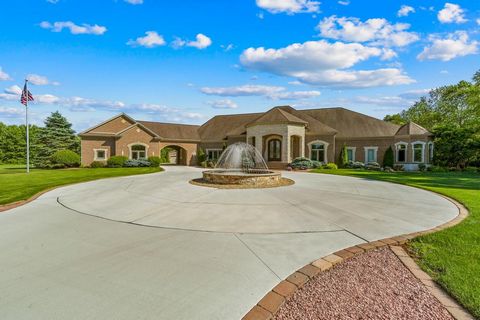 Welcome to this exclusive gated community nestled on 8.2 acres of private luxury living! This custom-built estate features 5 bedrooms, 5 full baths, and 4 half baths, offering upscale living at its finest. Just 15 mins away from Notre Dame University...