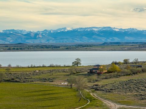 This Blue-Ribbon Wyoming Property has panoramic views of Ocean Lake with a backdrop of the Wind River Mountains that is sure to take your breath away. Offering a 2900 sqft home, shop, productive farmland, and a private well all perfectly situated on ...