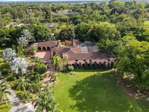 A hacienda 10-Acre Oasis in Flamingo Gardens - Seize Your Slice of Paradise! Escape the ordinary with this sprawling estate, offering privacy and potential beyond compare. This 10-acre gem, untouched by HOA constraints, promises a world of opportunit...