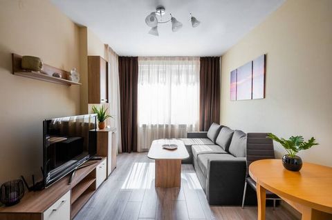 This cozy flat offers a comfortable living room where you can relax, a well-equipped kitchenette that has everything you need to prepare your favorite meals, and an inviting bedroom. Step outside onto the small balcony, complete with a table, and enj...