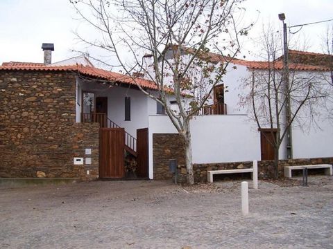 Stone house located in Janeiro de Baixo, Aldeia do Xisto, overlooking the Zêzere River and river beach. It is located in the square in front of the church, close to the children's garden and approximately 200 meters from the river beach bar. The hous...