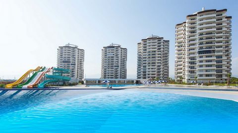 The housing complex is located in the Cesmeli neighborhood of Erdemli, Mersin, 500 m from the sea and close to the D400 Antalya highway. It is situated on the Mediterranean coast, at the foot of the Taurus Mountains, where green and blue meet. Erdeml...