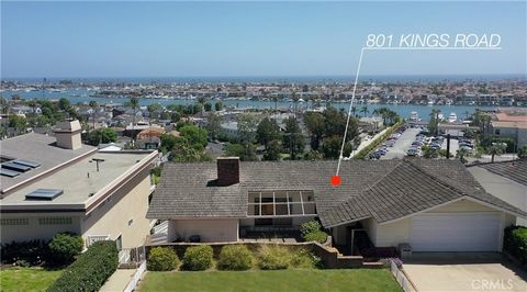 801 Kings Road presents an extraordinary opportunity for discerning buyers. Let's delve into the details of this remarkable property: Location and Views: Situated atop Newport Beach's premier address, this property boasts 70 feet of front-row width a...