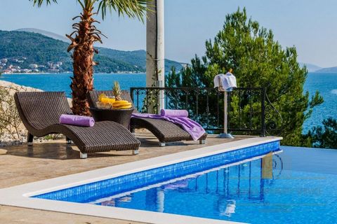 Elegant villa in an attractive location 20 m from the sea, in Marina, 15 km from the charming UNESCO town of Trogir. Split International Airport is 10 km from the villa. The villa has a living area of ​​247m2 spread over three floors. On the ground f...