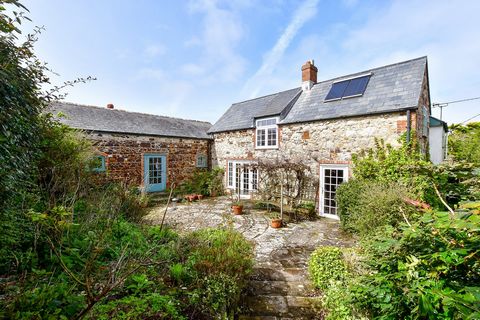 This charming character cottage, tucked away down a quiet lane in the breathtaking western tip of the island is set within vast grounds and packed with original features throughout.   The living areas comprise a traditional style kitchen with a gorge...