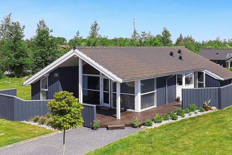 Holiday cottage at Hasmark strand. When building and decorating the house great importance has been put on making the house bright. The house has 3 bedrooms and an annex. 2 bathrooms and a whirlpool. Large combined living/dining room furnished with g...