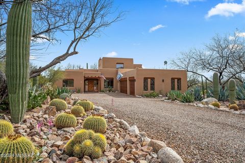 Gorgeous home located in the desirable Tanque Verde Valley near Redington Road. Tranquility abounds with this amazing saguaro studded property with outstanding city, mountain, and sunset views. Bright and spacious split bedroom floor plan w/ beautifu...