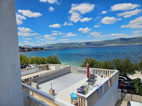 In the distinguished locale on the island of Čiovo, stands a residence of grandeur beside a pristine pebble beach and crystalline waters. This capacious abode, spanning 300 m2, is divided into two distinct apartments, each exuding its own unique allu...