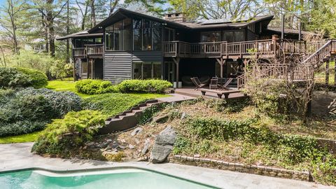 Iconic modern design defines this turnkey Mid Century Modern privately sited on a .78 acre at the end of a cul-de-sac with wraparound decks, a salt water pool, blue stone patio and an organic garden bordering the scenic Leatherstocking Trail. This am...